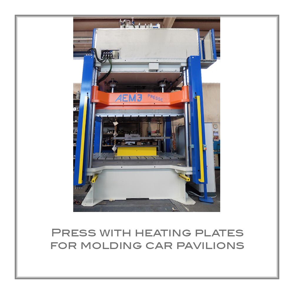 Press with heating plates for molding car pavilions